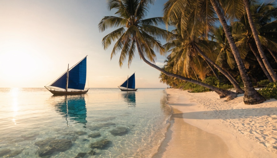 Paraw sailboats at White Beach, Boracay — Philippine travel deals